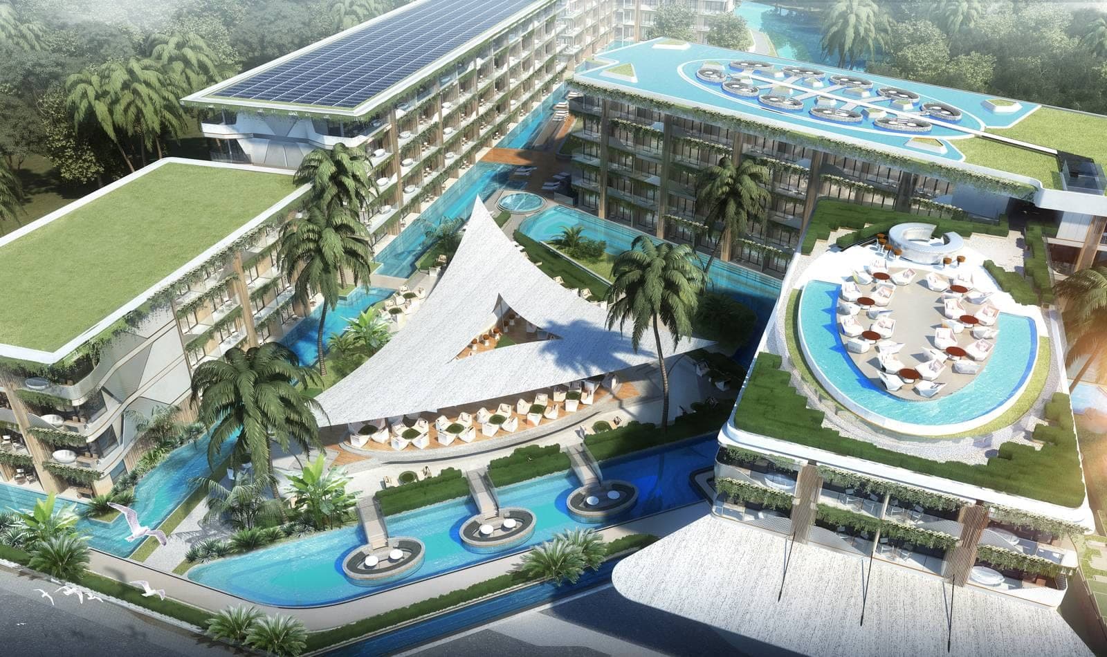 Aerial view of the resort pools and beachfront